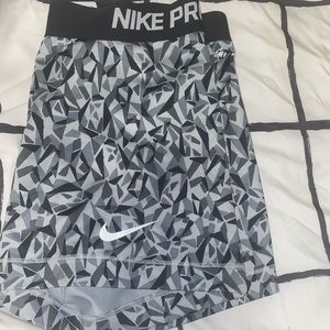 Grey,black,and dark grey Nike Pros